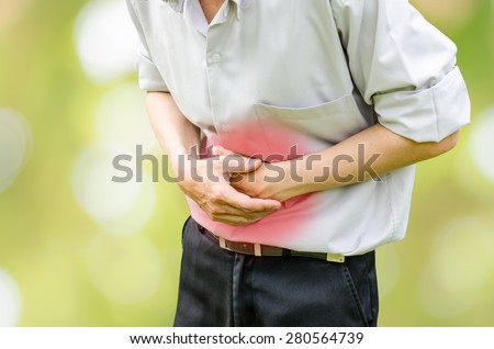 Man suffering from stomach ache because he has diarrhea