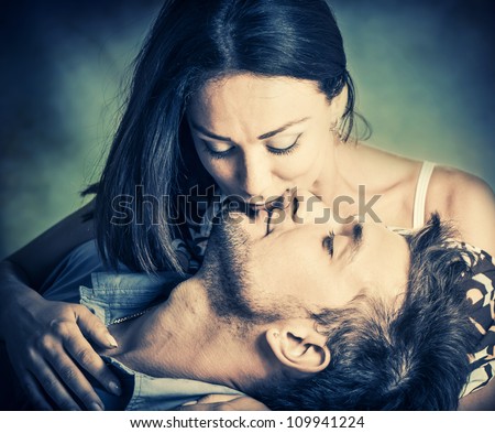 woman kissing her boyfriend in lips