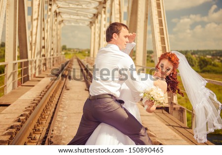 wedding couple dance at railway construction