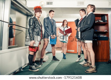 lady boss with four office workers without pants at office interior