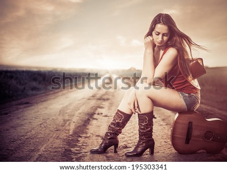 sad woman at sunset road view