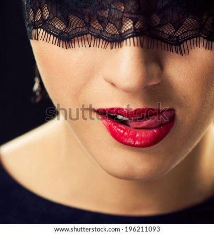 sexy woman face with tongue closeup