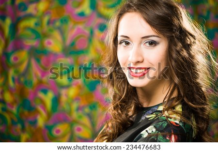 young smiling woman portrait indoor at abstract background