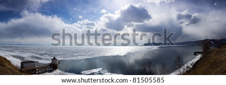 wide-angle photo of Baikal lake with lighthouse
