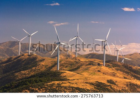 landscape with hills and wind turbines