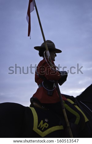 OTTAWA, CANADA - JUNE 27, 2013: The Royal Canadian Mounted Police (RCMP) Musical Ride performs during its Sunset Ceremonies series in Ottawa, Canada on June 27, 2013.