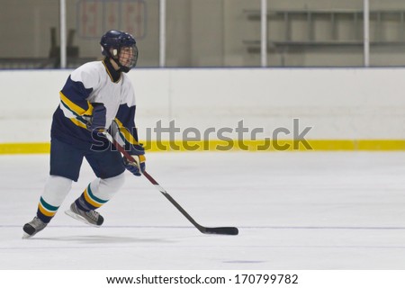 Woman ice hockey player during a game