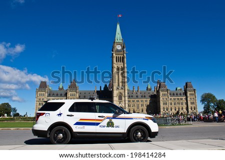 OTTAWA, ONTARIO/CANADA - AUGUST 10, 2013:  An Royal Canadian Mounted Police (RCMP) vehicle guards Parliament Hill in Ottawa, Canada.