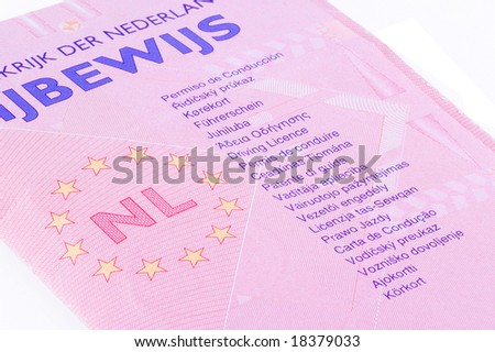 Dutch drivers license with indication in many languages; isolated on a white background.