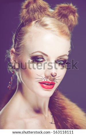 beautiful young blond woman in fancy dress with fox vanilla processing in a vintage style glamor