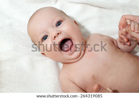 Happy child with an open mouth on a white background
