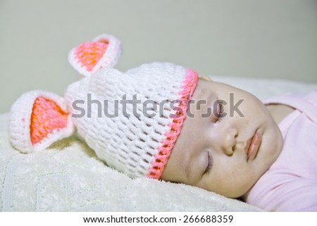 Sleep baby  dressed in Easter bunny