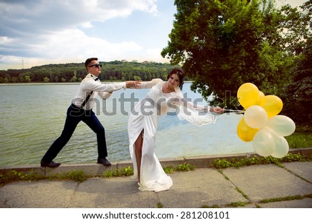 unusual wedding photos with humor.the couple at the lake