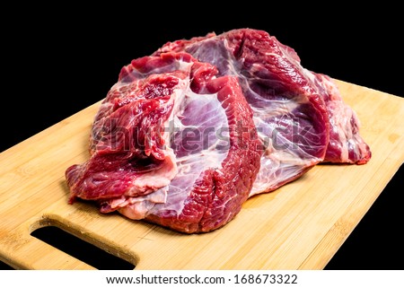 Beef fat piece on the wooden deck