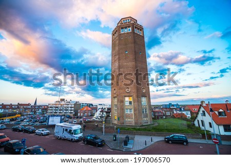 ZANDVOORT, NETHERLANDS - 11 May 2014 Scenic view of Zandwoort town center at sunset with the water tower in the foreground on 11 May 2014, Zandvoort, Netherlands