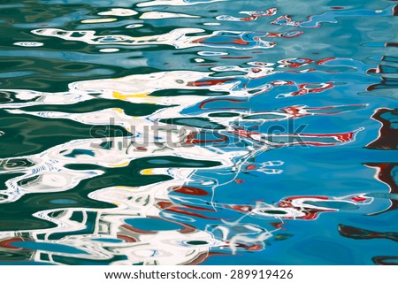 Abstract water background. Bright colorful water reflection. Nautical art photography. Blue sea ripples