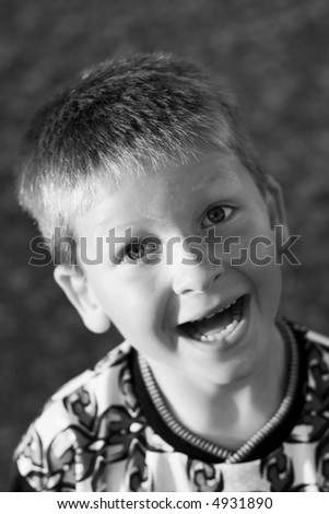 Black and White portrait of a happy child.