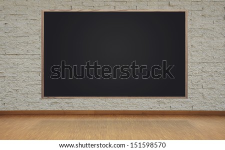 blank blackboard on brick wall in office