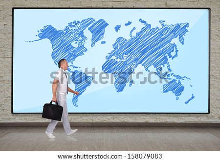businessmen walking at big plasma panel with world map