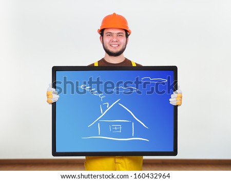 builder with beard holding plasma panel with house