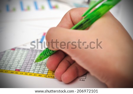 financial worker analyzing statistical data, close up