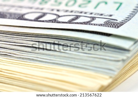 Heap of one hundred dollar bills, close up