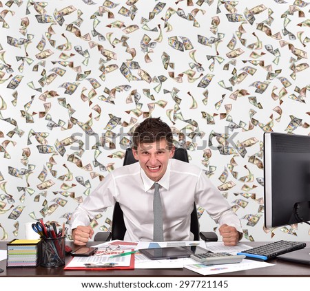 angry businessman and falling dollar bills