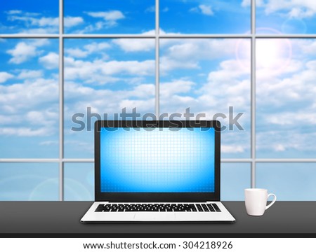 Laptop on table with blank screen and coffe cap