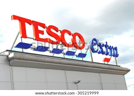 Cradley Heath, West Midlands, UK - August 11 2015: Tesco supermarket sign with logo. Retail food prices are falling with all supermarkets including Tesco cutting their prices.