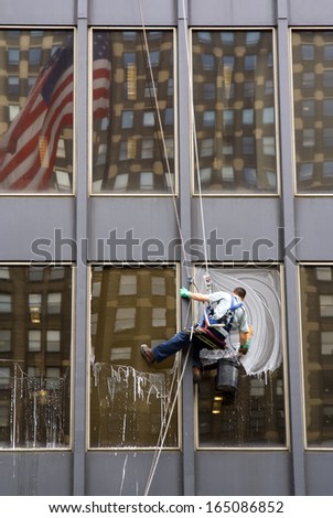 Window Washer with American Flag Reflection