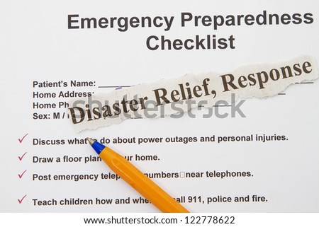 Emergency checklist preparedness abstract with pen and form.