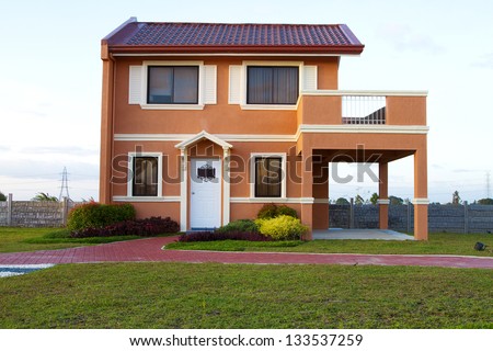 Sold Single family yellow orange  house with cyan sky background.