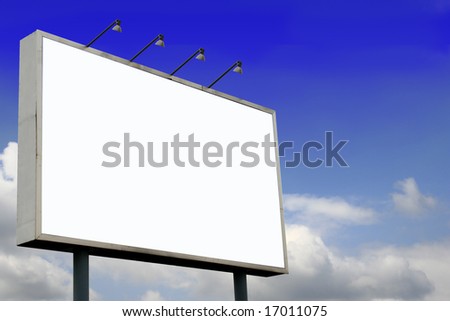 Blank Billboard  with lamps and blank screen for commercial use in a beautiful blue sky background