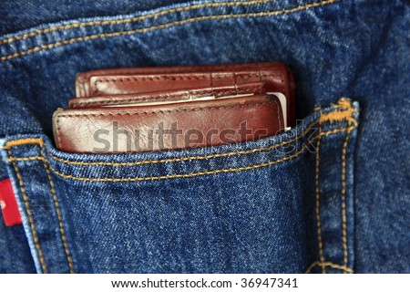 Wallet in back pocket of blue jeans