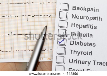 close up of ecg graph medical background and diabetes result