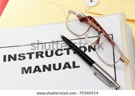 instruction manual user guide with pen and eyeglass