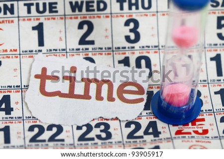 hourglass on calendar sheets with time cutout.