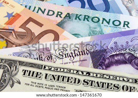 A close-up photograph of  Swedish, United States and Euro currency.