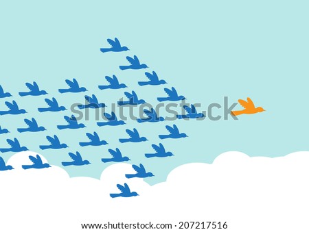 Birds flying in the formation of an arrow shape, following a leader bird. A metaphor on teamwork and leadership.