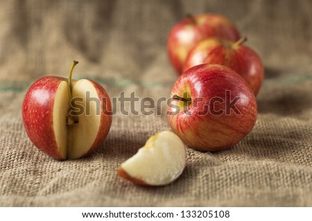 Tasty red apples whit slice on table.Organic food production