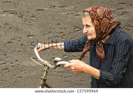 Active elderly woman with her bike.