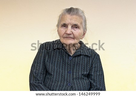 Portrait of an old woman. Dreaming the past.