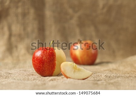 Tasty red apples on table, organic food production. Selective focus with shallow depth of field.