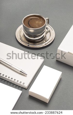 Blank stationery set : coffee cup, business cards, booklet, sheets, notebook, CD, boxes and pencil.