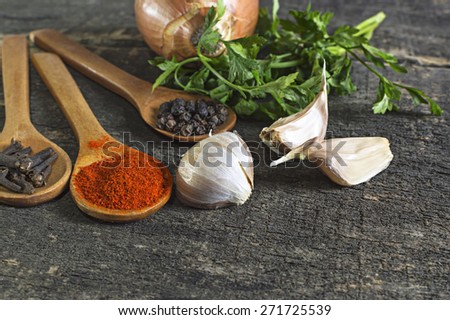 Various kinds of spices on wooden planks. Shallow depth of field