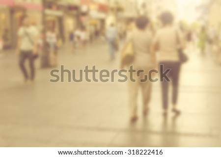City commuters. High blurred image of crowd people on street, unrecognizable faces.