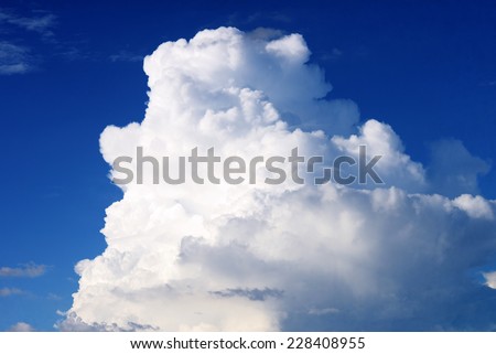 Cumulus clouds against the blue sky