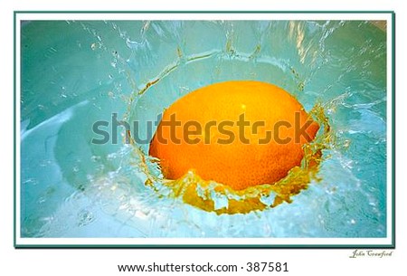 A lemon dropped into a cold bucket of water