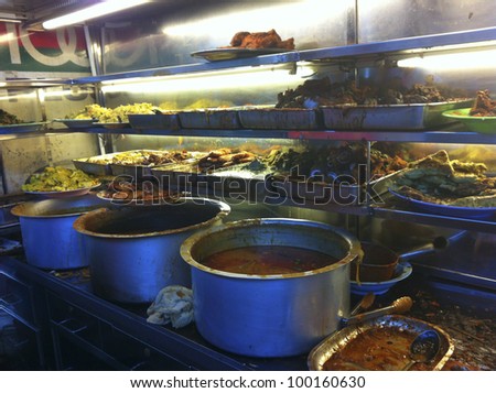 PENANG, MALAYSIA-APRIL 13:Variety of spicy dishes for \'nasi kandar\' or \'kandar rice\' in Penang, Malaysia on April 13, 2012. Nasi kandar is a popular spicy dish originating from Penang Indian Muslim