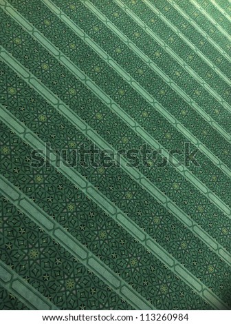 Intricate praying mat in a mosque Intricate praying mat in a mosque